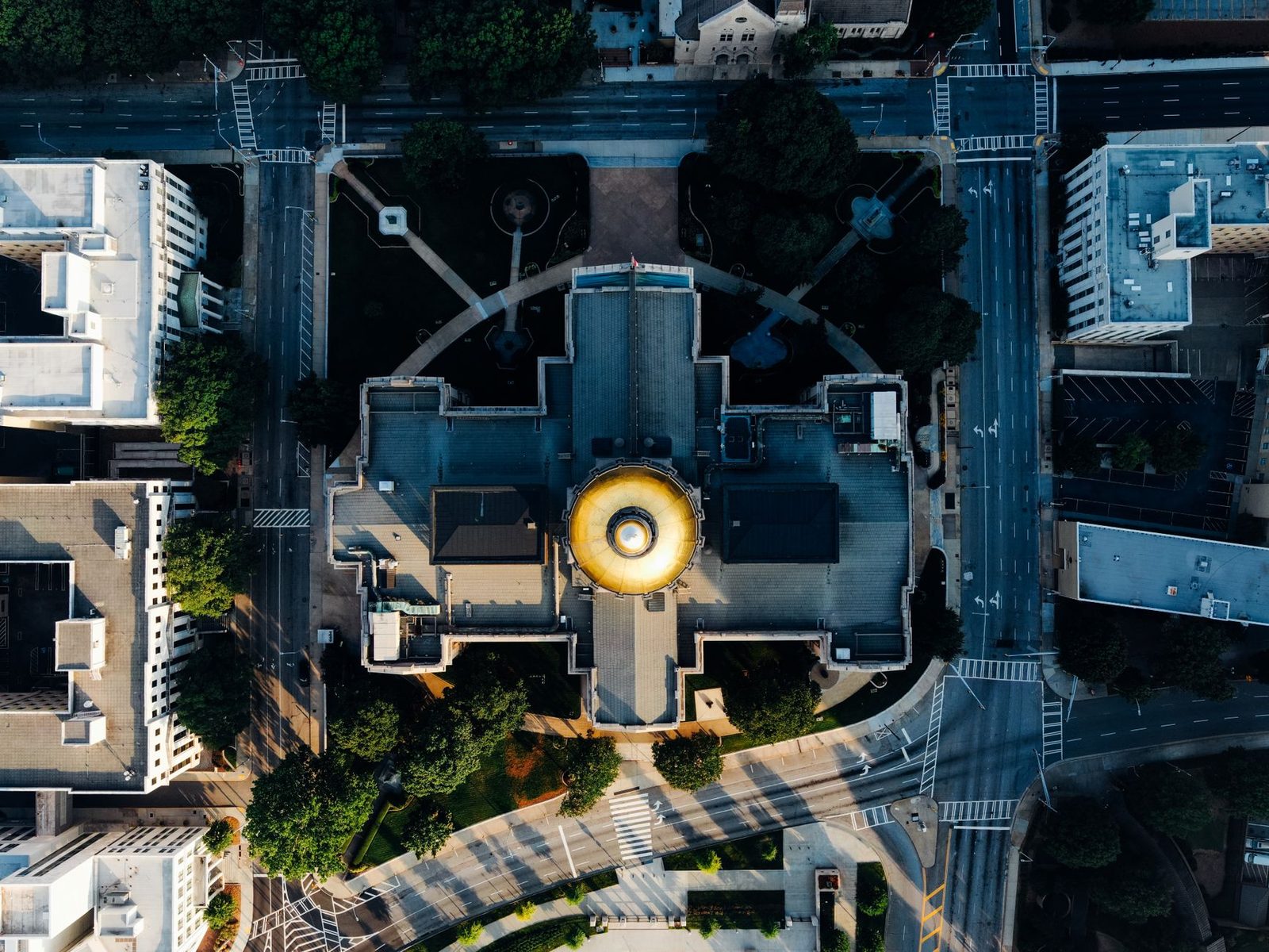 Aerial view of the Georgia State Capitol in Atlanta, showing its gold dome.