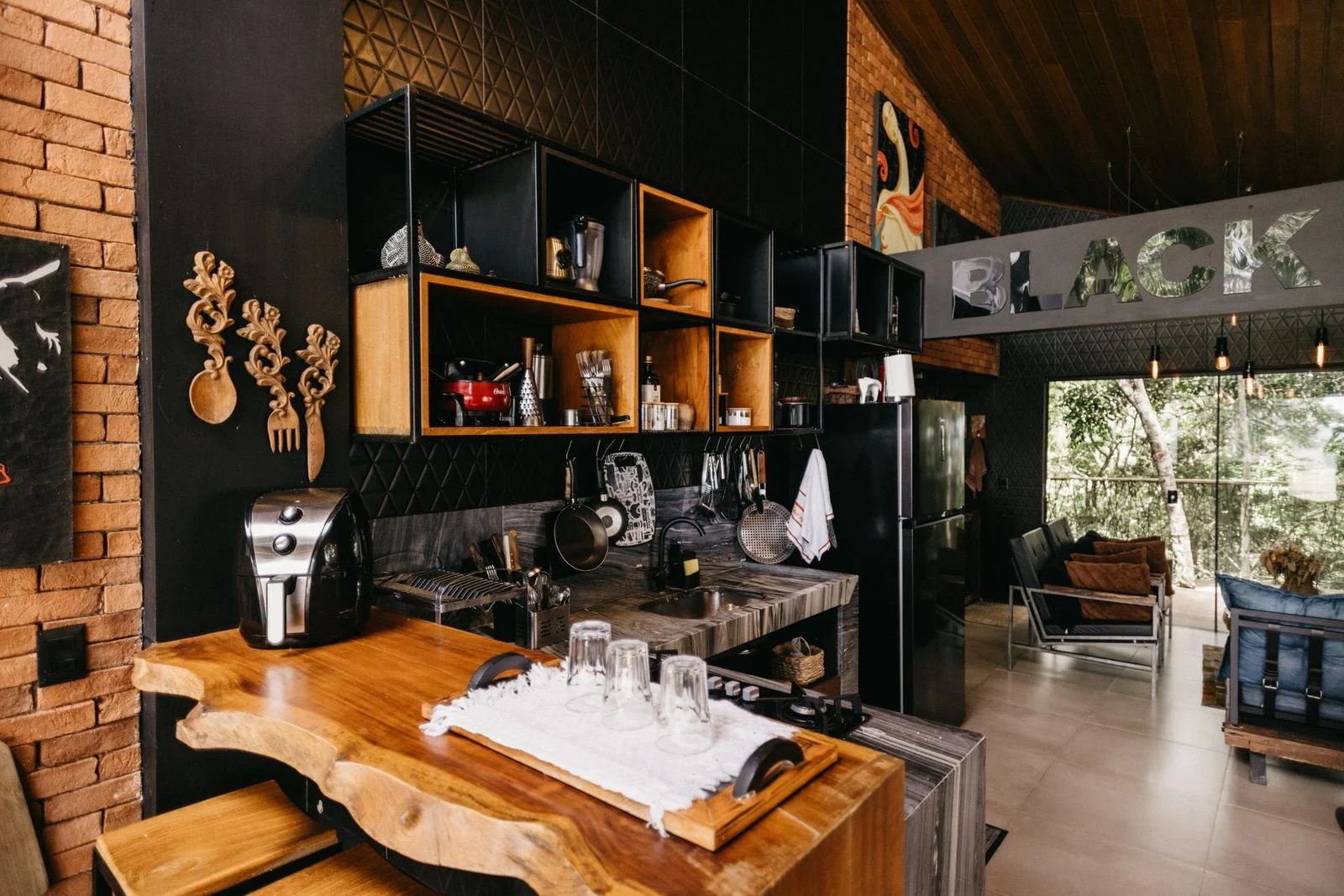 Modern kitchen with wooden cabinets and contemporary decor.